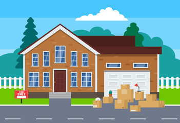 moving day concept.cardoard boxes near house for sale