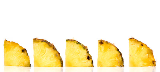 pieces of ananas on a white background