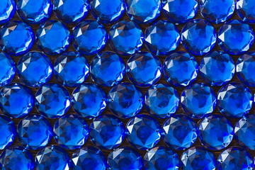 Precious sparkling rhinestones blue colors on a dark background