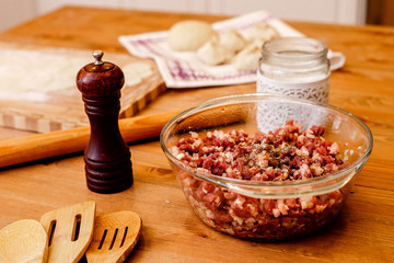 Raw meat is finely chopped on a plate ready to be cooked
