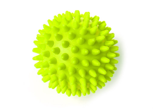 Green colorful bright isolated spiky ball toy, macro