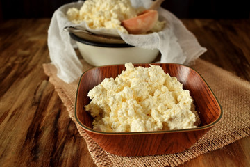 Cottage cheese in a wooden bowl