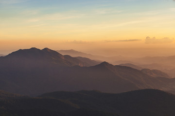 Golden sky with sunlight and the Mountains in sunset.