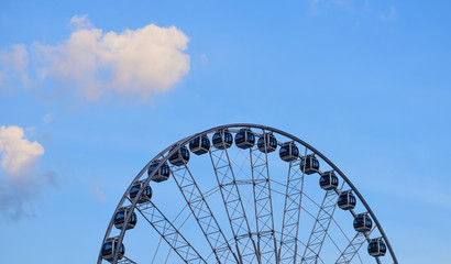 Ferris wheel with blue sky