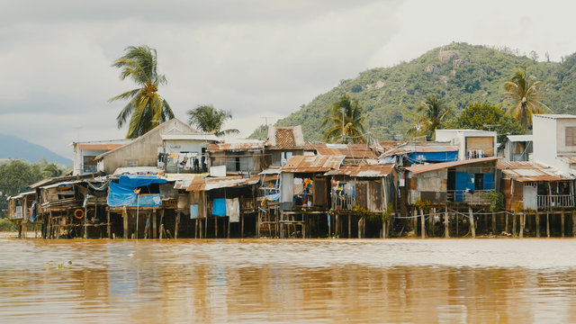Slums in Nha Trang. Houses on the river. Vietnam.