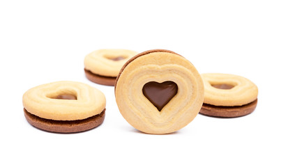 Chocolate heart in round biscuit isolated on white background