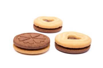 Chocolate heart in round biscuit isolated on white background