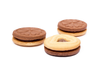 Chocolate heart in round biscuit isolated on white background