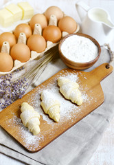 Baking Ingredients for Cooking Croissants. Dough, Eggs, White Sugar, Flour, Milk, Oil Butter. Preparation, Lavender Flowers. Kitchen Cuisine Table Grey Background, Homemade