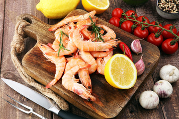Raw fresh Prawns Langostino Austral. shrimp seafood with lemon and spices.