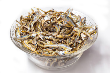 Close up of Japanese dried infant sardine used as seasoning in Japanese foods and cooking. Japanese healthy snack food. Niboshi or Iriko fish close up.