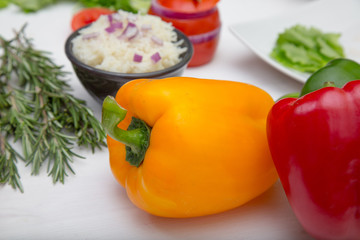 close-up peppers with rice inside bowl in the white background