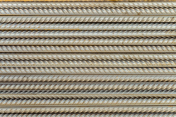 Steel reinforcing bars rods with periodic profile. Industrial abstract background.