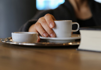 Fototapeta na wymiar Female holding a coffe cup 