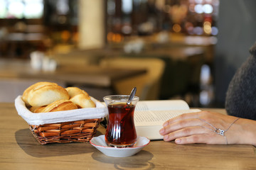 breakfast with tea and bread in a basket