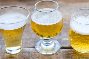 glass of beer on wooden table