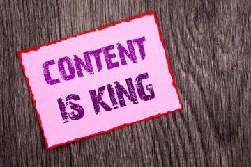 Handwriting Announcement text showing Content Is King. Conceptual photo Online Marketing Information Management With cms Or Seo Data written on Pink Sticky Note Paper on the wooden background.