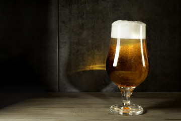 ale beer  in twilight on wood