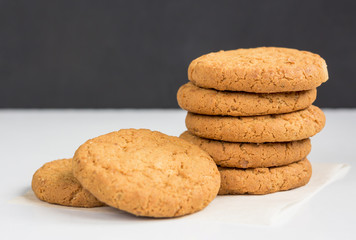 Stack of oatmeal cookies. Homemade gingerbread on table. Healthy Food Snack Concept.