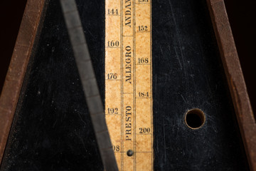 Detail of an old mechanic musical metronome