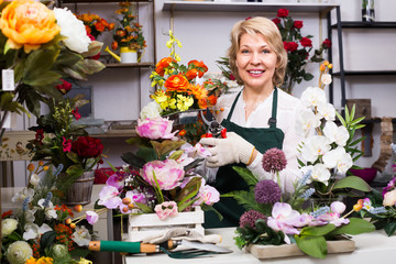 Female florist at the work .