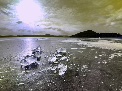 Shining shards of broken ice. Abstract still life of ice floes.