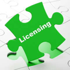 Law concept: Licensing on Green puzzle pieces background, 3D rendering