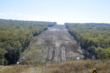 A clearing in the forest for the gas pipeline