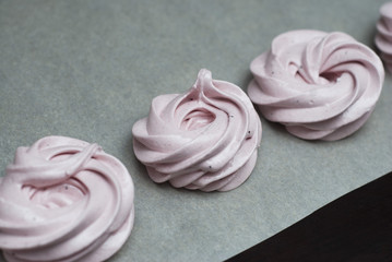 Marshmallow, Meringue, Zephyr over Baking Paper ready for Drying. Pink Dessert with Strawberry. Step by Step process.