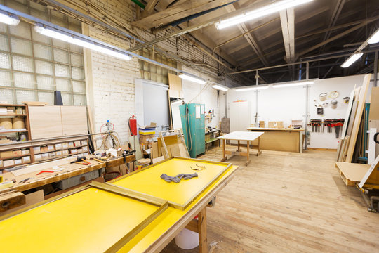 production, manufacture and woodworking industry concept - furniture factory workshop