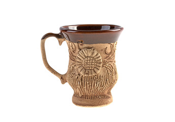 cup of clay handmade with a pattern on a white background