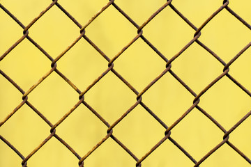 Fototapeta premium .Yellow texture with rusty mesh