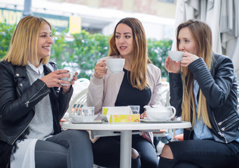 Three happy girl friends