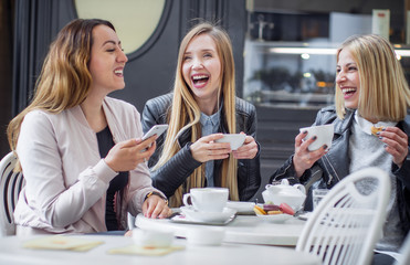 Girl friends drinking coffee