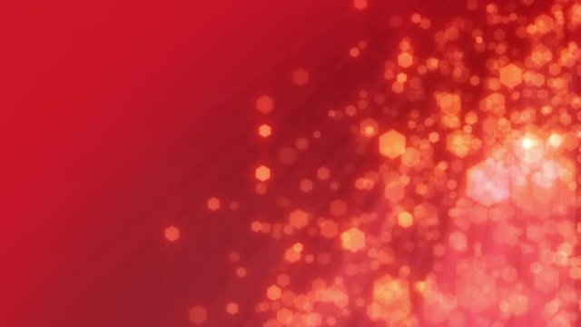 Christmas and celebration background loop. Defocused snow or glitter. Red sparkly hexagons falling on the right side, with copy space on the left. In 4K and HD.