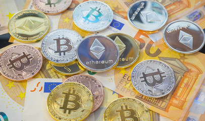 E-business Bitcoin BTC coins on bills of euro banknotes. Worldwide virtual internet cryptocurrency and digital payment system. Digital coin crypto money on bitcoin farm in digital cyberspace