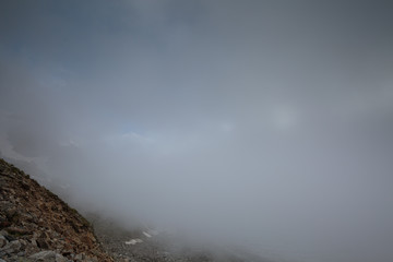 Movement of clouds and water flows in a stormy river in the Caucasus mountains in summer