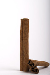 Cinnamon stick spice isolated on white background closeup.
