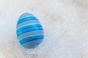 Beautiful bright postcard (background) for a light holiday of Easter - one multi-colored easter easter eggs