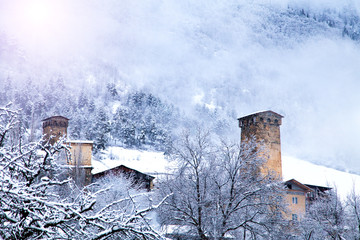 Mestia Svaneti Svan Medieval Tower Georgia. Sunny frosty snowy winter Landscape Panoramic view.