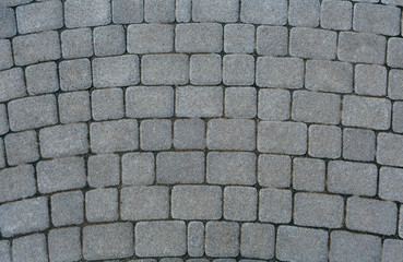 The texture of paving stone masonry, close up, top view. Exterior floor covering..Pavement background.