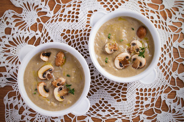 Creamy mushroom soup. Mushroom vegetable soup with thyme and parmesan cheese. View from above, top studio shot