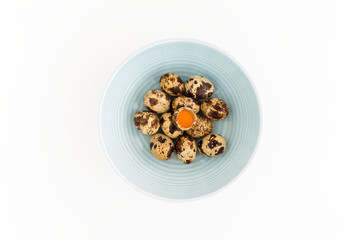 Quail Eggs in Blue Bowl on White Background