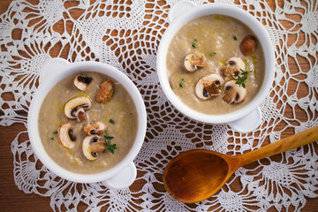 Creamy mushroom soup. Mushroom vegetable soup with thyme and parmesan cheese. View from above, top studio shot
