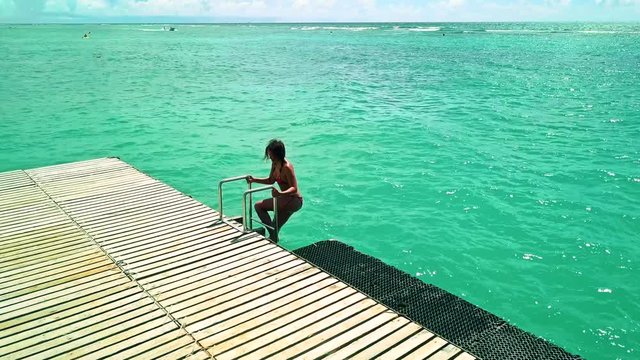 Beautiful girl escaping from the indian ocean, Mauritius