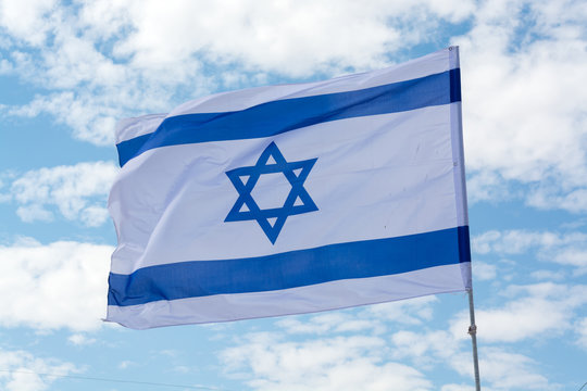 Flag of State of Israel and blue sky, white-blue with Star of David, Magen David, celebration of 70 years of israel, symbol of the state