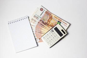 Save money concept - with pen, calculator and rubles