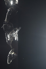 Shattered glass in stroboscopic photography. Black background. Florianópolis, Santa Catarina /...