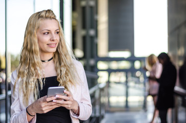 Young pretty woman with smartphone portrait