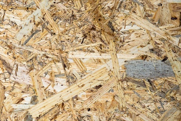 splinters and brackets on a wood background made of wood particle board